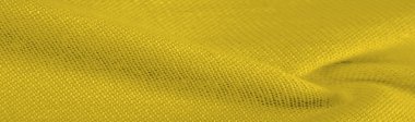 Sarı yün kumaş. Amber sarısı keçeli kumaş, soyut sanat. Arkaplan dokusu, desen