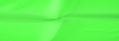 Yeşil ipek kumaş, zarif, dalgalı, yeşil saten ipek lüks kumaş, soyut tasarım. arkaplan dokusu, desen