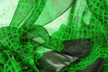 Tekstil malzemesinden yeşil arkaplan. dantel kumaş. Doğal zümrüt dokusu. Doku, arkaplan, desen.