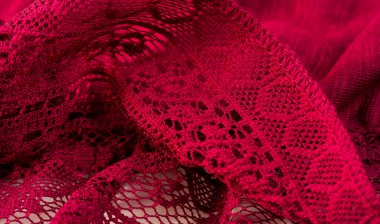 Kırmızı dantel kumaş, beyaz arka planda çiçek şekilli kırmızı dantel. arkaplan dokusu, desen.