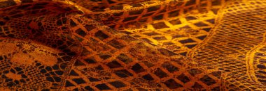 Kahverengi dantel kumaş, kehribar ve siyah kumaş karışımı. Kehribar, doku, arkaplan, desen.