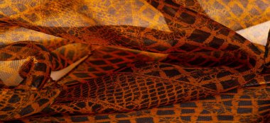 Tekstil malzemesinden kahverengi arka plan. dantel kumaş. Doğal kehribar dokusu. Doku, arkaplan, desen.