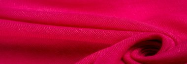 Kırmızılı ipek kumaş. İnce taneli Grunge yüzey dokusu, kızaran saten doku, yakut bir kumaş, ipek panorama, güzel yumuşak doğal bulanık desenli.