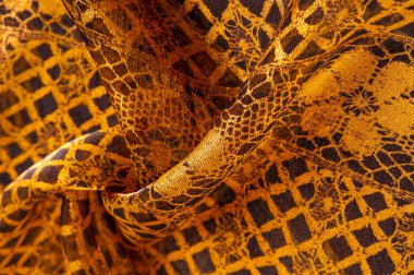 Tekstil malzemesinden kahverengi arka plan. dantel kumaş. Doğal kehribar dokusu. Doku, arkaplan, desen.