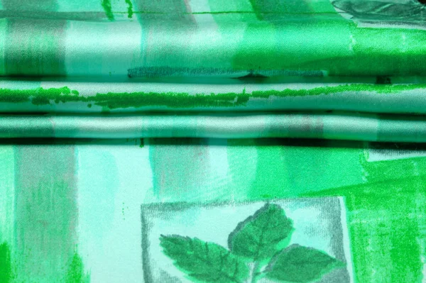 Texture. Background. Template. green lettuce gray silk fabric with an abstract pattern, a print of flora twigs. verdant, lawny, virid, vealy