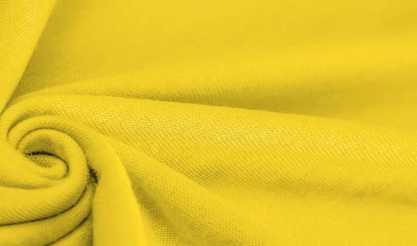 Yellow woolen fabric. Amber yellow felt texture, abstract art. Background texture, pattern