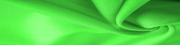 green silk fabric, beautiful smooth elegant, wavy, green satin silk luxury fabric, abstract design. background texture, pattern