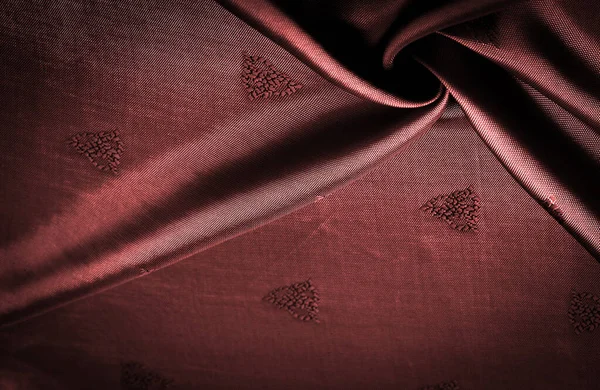 silk fabric, red, sienna, fine pattern, which is a combination of lines, colors, shadows. texture background, pattern