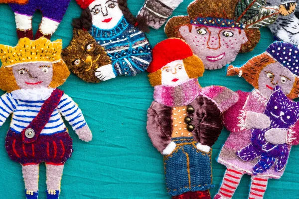 Flea market,  folk crafts. Handmade rag dolls. A rag doll is a children\'s toy. It is a cloth figure, a doll traditionally home-made from and stuffed with spare scraps of material.