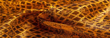 Tekstil malzemesinden kahverengi arka plan. dantel kumaş. Doğal kehribar dokusu. Doku, arkaplan, desen.