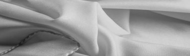 Tek renkli ipek kumaş, zarif, dalgalı, siyah beyaz saten ipek kumaş, soyut tasarım. arkaplan dokusu, desen