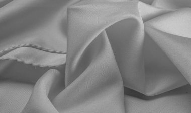 Tek renkli ipek kumaş, zarif, dalgalı, siyah beyaz saten ipek kumaş, soyut tasarım. arkaplan dokusu, desen