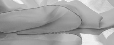 Tek renkli ipek kumaş, zarif, dalgalı, siyah beyaz saten ipek kumaş, soyut tasarım. arkaplan dokusu, desen