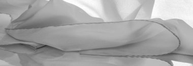 Tek renkli ipek kumaş, zarif, dalgalı, siyah beyaz saten ipek kumaş, soyut tasarım. arkaplan dokusu, desen