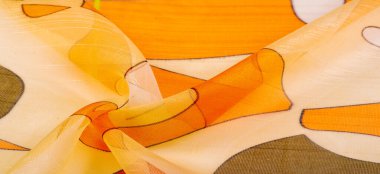 İnce örülmüş kumaş, şeffaf, kırmızı, beyaz ve sarı geometrik renkler, ince yapışkan ipekten yapılmış. Organza deseni. Doku. Arkaplan