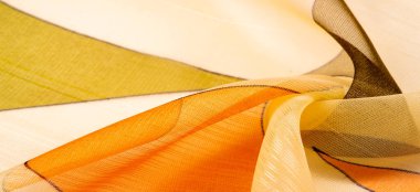 İnce örülmüş kumaş, şeffaf, kırmızı, beyaz ve sarı geometrik renkler, ince yapışkan ipekten yapılmış. Organza deseni. Doku. Arkaplan
