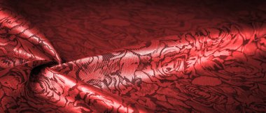 Çiçek desenli kırmızı ipek kumaş, güzel görünüş, eşsiz parlaklık kabartmalı desen, bileşik tekstil. rahatlama deseni