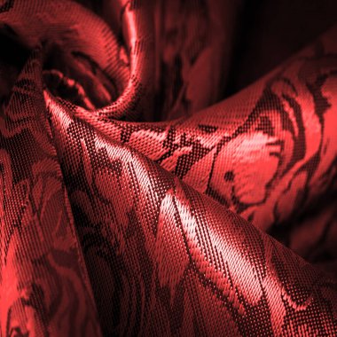 Çiçek desenli kırmızı ipek kumaş, güzel görünüş, eşsiz parlaklık kabartmalı desen, bileşik tekstil. rahatlama deseni