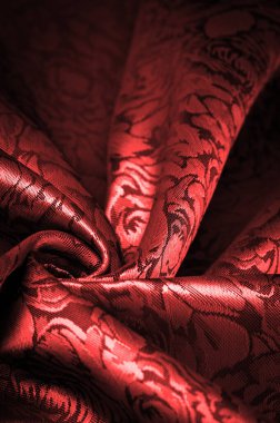Çiçek desenli kırmızı ipek kumaş, güzel görünüş, eşsiz parlaklık kabartmalı desen, bileşik tekstil. rahatlama deseni
