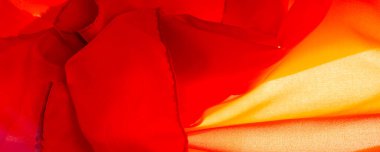 kırmızı ipek kumaş, güzel pürüzsüz zarif, dalgalı, yakut rengi ipek, lüks kumaş, doku arka planı, makro. Soyut tasarım. şablon