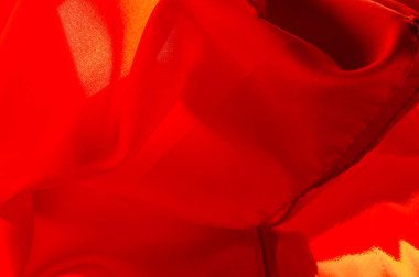 Kırmızı ipek kumaş, yakut rengi ipek kumaş, doku arka planı, makro. soyut tasarım.