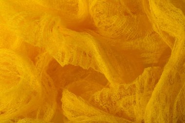 Doku arka planı, desen. Ağ sarısı kumaş. Tasarımınızda, duvar kağıtlarınızda ve ev dekorunuzda aksanınız için ideal. Renkler arasında beyaz ve sarı.