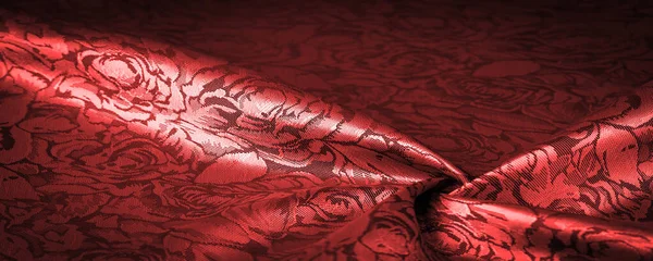 Çiçek desenli kırmızı ipek kumaş, güzel görünüş, eşsiz parlaklık kabartmalı desen, bileşik tekstil. rahatlama deseni
