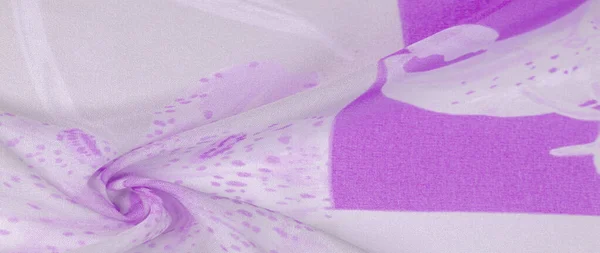 Silk fabric, purple flowers on a silver white background. this delicate fabric in pastel colors will evoke imagination. Texture, background pattern,