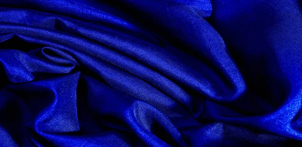 Mavi kumaş. Doğal kumaştan soyut kırmızı arkaplan. Pamuk. Doku, arkaplan, desen