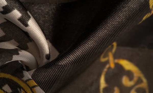 İpek kumaş tarçın bej sarısı, Picturesque, geometrik, çiçekli ve diğer elementlerin kombinasyonuyla grafik dekorasyonu. Arkaplan dokusu, dekoratif süs