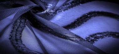 Mavi çizgili ipek kumaş. Safir tonlarında soyut ipek renkler. Kumaşta eski model. Arkaplan dokusu, dekoratif süs