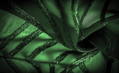 Yeşil çizgili ipek kumaş. Zümrüt tonlarında soyut ipek tonlar. Kumaşta eski model. Arkaplan dokusu, dekoratif süs