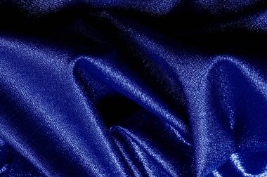 Parlak mavi, turkuaz, metalik gümüş iplikli gök mavisi kumaş. Doku, arkaplan,