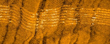 Arkaplan deseninin dokusu, süs süsü, altın sarısı kıvrımlı kumaş, paralel ya da çapraz kıvrımlı kumaş; böyle bir kumaştan çıkan ürünler.