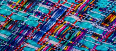 Arka plan dokusu, desen. Kış kumaşı, sıcak. Büyük örgülü iplik. Mavi-kırmızı sarı iplikler. Bu fotoğraf senin tasarımını en iyi yapacak. Duvar kağıtları, resimler, posterler.