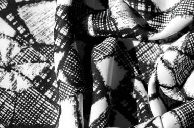 doku, arkaplan, desen. Siyah soyut figürlü beyaz kumaş. İlham her projenin özünde yatar. Güzel bir tasarım yapsanız da yapsanız da fark etmez.,