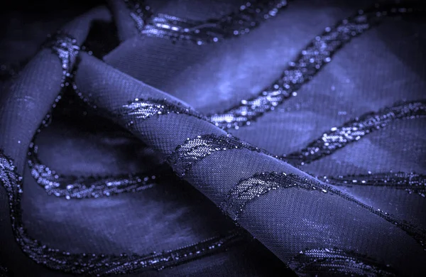 Mavi çizgili ipek kumaş. Safir tonlarında soyut ipek renkler. Kumaşta eski model. Arkaplan dokusu, dekoratif süs