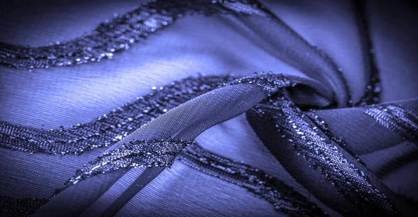 Doku arkaplan resmi, kumaş şeffaf koyu mavi, parlak doğuştan gelen çizgilerle, ışığın içinden geçmesine izin veren madde, böylece nesneler açıkça görülebilir..