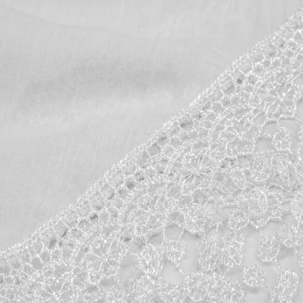 Spring white silk with lace capes. Sleek, elegant white silk or luxe satin can be used as an abstract background. Background texture, postcard template