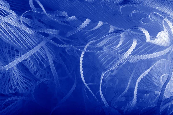 Mavi tül kumaş dokusu, yumuşak malzemeli lüks tül kumaş deseni. Doku, arkaplan, desen.