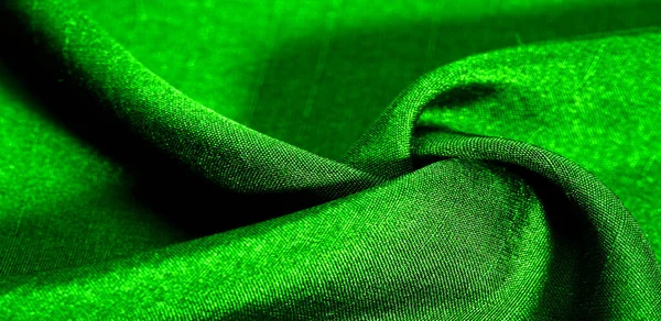 Yeşil kumaş. Doğal kumaştan soyut kırmızı arkaplan. Pamuk. Doku, arkaplan, desen