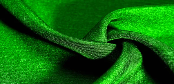 Yeşil kumaş. Doğal kumaştan soyut kırmızı arkaplan. Pamuk. Doku, arkaplan, desen