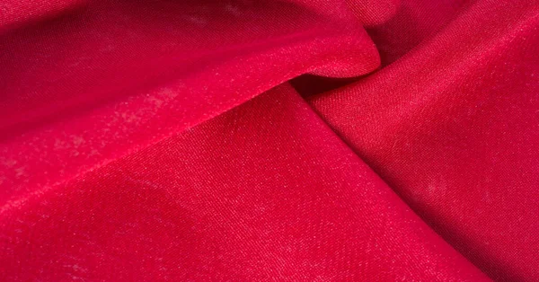 Kırmızı ipek kumaş. Hoş bir parlaklığı olan çok hafif yapışkan kumaş. Çevrimiçi projelerine zarafet katmak için mükemmel. doku arkaplanı, desen