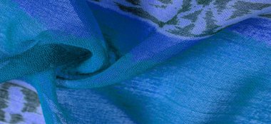 Kumaştaki soyut desen, büyük örgülü bir iplik, mavi beyaz çizgiler, projeleriniz için bu kumaş. Doku 