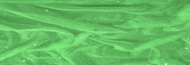 Klasik ve modern tasarım kütüphanesi ile bilinen renkli parıltılı şeffaf yeşil kumaş. doku, arkaplan,