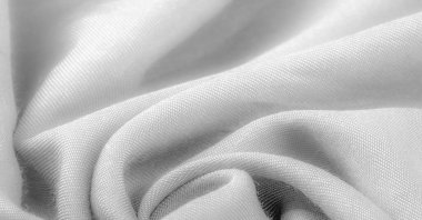 Beyaz kumaş, kumaş. Çapraz iplik dokuması olan ince kumaş. Latince ve Fransızca 'dan, materyalin adı tercüme edilmiş doku, arkaplan
