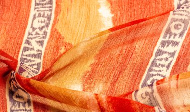 Kumaştaki soyut desen, büyük örgülü iplik, kırmızı-sarı bej desenli çizgiler, projeleriniz için bu kumaş. Doku 