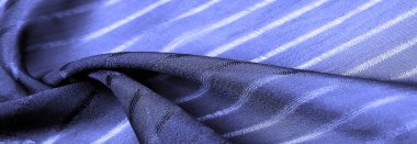  Çizgileri olan basit mavi kumaş. İpin, dokunun, arkaplanın çıkarılması ile oluşturulan çizgiler