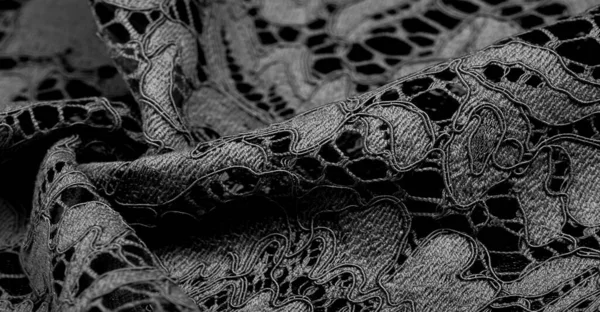 black lace fabric, delicate embossed lace fabric, scalloped on both edges. Suitable for your projects, design, etc. Texture, background