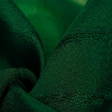  Çizgileri olan basit yeşil kumaş. İpin, dokunun, arkaplanın çıkarılması ile oluşturulan çizgiler,